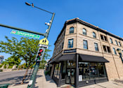 Thumbnail 6 of 7 - A street view of Josephine St with a building on the corner.