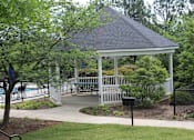 Thumbnail 1 of 6 - a gazebo in a park with benches