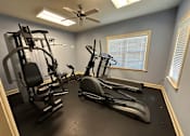 Thumbnail 3 of 4 - the gym has plenty of exercise equipment and a ceiling fan