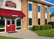 Thumbnail 17 of 18 - A building with a red awning and a sign that says "Burning Tree Information & Business Center".
