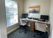 Thumbnail 5 of 9 - an office with two desks and two computers and a window