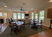 Thumbnail 4 of 9 - a dining room and living room with a couch and a table