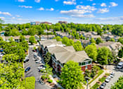 Thumbnail 11 of 13 - A suburban neighborhood with houses and parked cars.