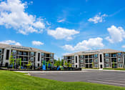 Thumbnail 4 of 22 - Two identical buildings with a playground in between.