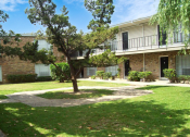 Thumbnail 4 of 7 - an exterior view of a building with a lawn and trees