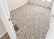 Thumbnail 19 of 23 - A room with a carpet floor and a window.