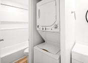 Thumbnail 27 of 31 - a small bathroom with a washer and dryer in it at The Courts Midtown, Memphis, TN, 38104
