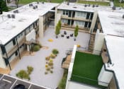 Thumbnail 31 of 31 - an aerial view of the courtyard of a building with green grass at The Courts Midtown, Memphis, TN
