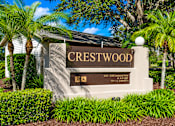 Thumbnail 3 of 26 - A sign that says Crestwood in front of some trees.