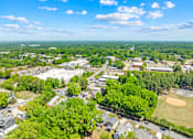 Thumbnail 5 of 9 - A bird's eye view of a residential area with a baseball field.