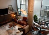 Thumbnail 1 of 24 - Living Area With Dining at Parcels at Concourse, Memphis