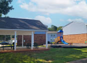 Thumbnail 2 of 3 - a house with a yard with a playground and a pavilion