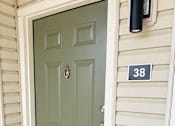 Thumbnail 9 of 33 - A green door with a number 38 on the wall above it.