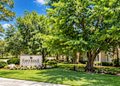 Thumbnail 19 of 33 - A sign that says Fawn Ridge Estates is in front of a building.
