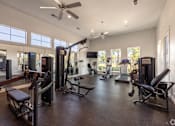 Thumbnail 8 of 23 - A spacious home gym with a variety of equipment.