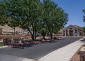 Thumbnail 1 of 4 - a building with a street and trees in front of it
