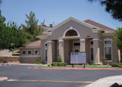Thumbnail 3 of 4 - a building with a sign in front of it
