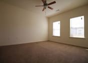 Thumbnail 5 of 13 - an empty living room with a ceiling fan