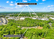 Thumbnail 8 of 10 - An aerial view of a location with a Restaurants & Shopping Area and Glenwood Gardens.