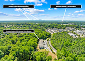 Thumbnail 9 of 10 - An aerial view of a wooded area with Crowders & Kings Mountain State Park, Glenwood Gardens, and Downtown Gastonia marked.