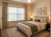 Thumbnail 4 of 5 - A bedroom with a large bed and a window with blinds.