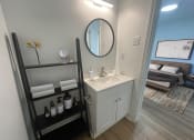 Thumbnail 7 of 31 - a small bathroom with a sink and a mirror at The Courts Midtown, Memphis, Tennessee