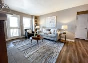 Thumbnail 16 of 38 - an open living room with a couch and a rug