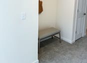 Thumbnail 37 of 65 - an empty room with a bench and a closet