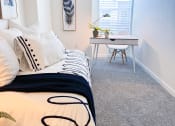 Thumbnail 18 of 65 - an example of a bedroom with a bed and a desk