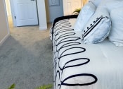 Thumbnail 40 of 65 - a bedroom with a large bed and a closet