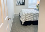 Thumbnail 27 of 65 - an empty bedroom with a bed and a window