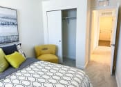 Thumbnail 17 of 65 - a bedroom with a bed and a doorway to a closet