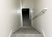 Thumbnail 35 of 65 - a view of a hallway with a carpeted floor and stairs