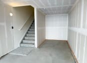 Thumbnail 51 of 65 - an empty room with stairs and a white wall