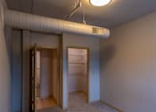 Thumbnail 22 of 25 - A room with a white ceiling and a white air conditioning unit.