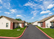 Thumbnail 25 of 33 - A row of houses with a red line on the sidewalk.