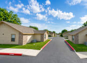 Thumbnail 29 of 33 - A street view of a residential area with houses on both sides.