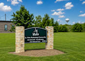 Thumbnail 31 of 33 - A sign for La Vista Retirement Community stands in a grassy field.