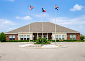 Thumbnail 33 of 33 - A building with a flag on top of it.