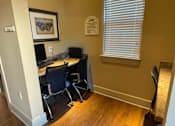 Thumbnail 5 of 5 - a home office with a desk and a computer