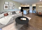 Thumbnail 2 of 23 - A modern living room with a grey couch and a coffee table in the center.
