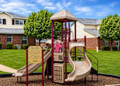 Thumbnail 9 of 14 - A playground with a slide and a sign that says "Welcome".