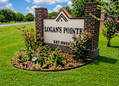 Thumbnail 1 of 14 - A sign for Logan's Pointe with a phone number on it.