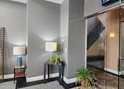 Thumbnail 3 of 43 - Leasing center lobby and a staircase in the background.