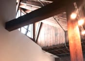 Thumbnail 19 of 34 - a view of the ceiling of a building with exposed beams