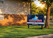 Thumbnail 7 of 16 - A sign for Shady Oaks Manor is displayed on a grassy area.