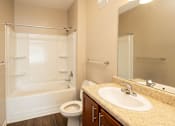 Thumbnail 8 of 18 - a bathroom with a sink toilet and a shower