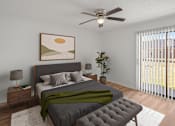 Thumbnail 4 of 28 - A bedroom with a bed, nightstands, and a ceiling fan. at Osage Creek, Rogers, AR, 72756