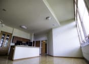 Thumbnail 91 of 100 - A large open room with a bar and wooden floors.