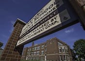 Thumbnail 96 of 100 - A sign in front of a building that says "Historic Lincoln School".
